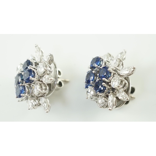 543 - A pair of modern 750 white gold, set sapphire and diamond cluster ear studs, each set with five roun... 