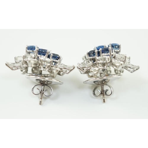 543 - A pair of modern 750 white gold, set sapphire and diamond cluster ear studs, each set with five roun... 