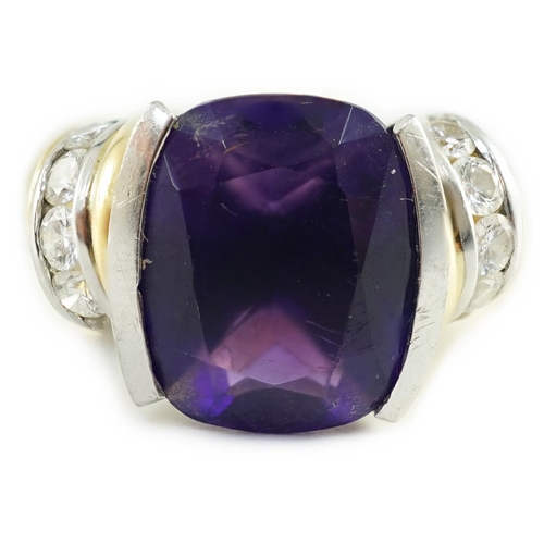 544 - A modern 18ct gold and cushion cut amethyst set dress ring, with ten stone round cut diamond set sho... 