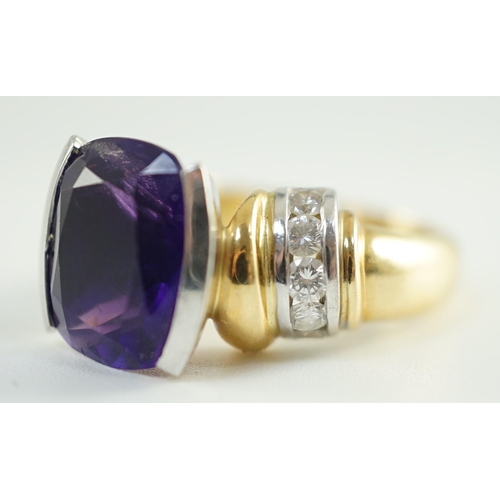 544 - A modern 18ct gold and cushion cut amethyst set dress ring, with ten stone round cut diamond set sho... 