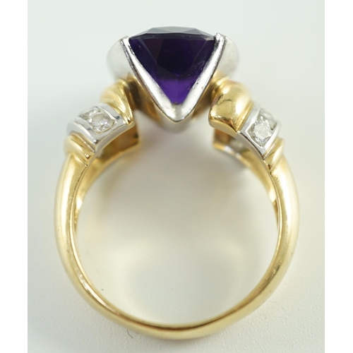 544 - A modern 18ct gold and cushion cut amethyst set dress ring, with ten stone round cut diamond set sho... 