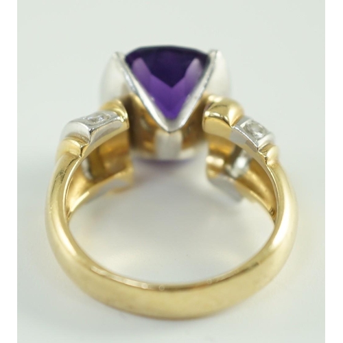 544 - A modern 18ct gold and cushion cut amethyst set dress ring, with ten stone round cut diamond set sho... 