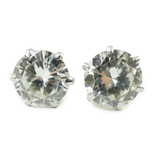 546 - A pair of white gold and solitaire diamond set ear studs, the stones diameter 6.2mm and 6.3mm, gross... 