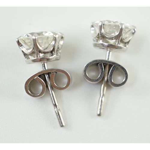 546 - A pair of white gold and solitaire diamond set ear studs, the stones diameter 6.2mm and 6.3mm, gross... 