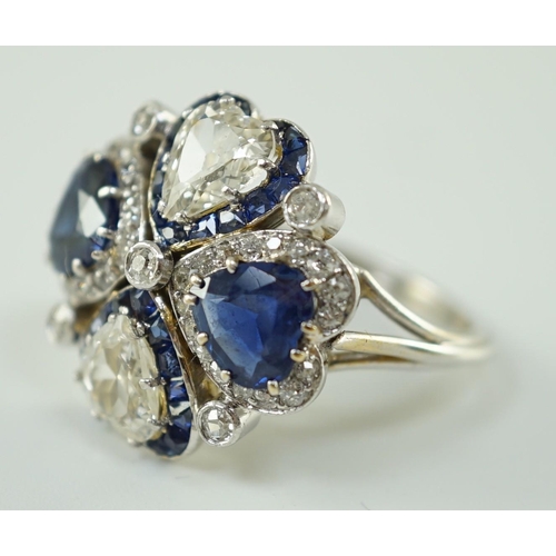 551 - An attractive 18ct white gold, two stone heart shaped diamond and two stone heart shaped sapphire se... 