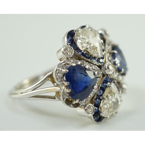 551 - An attractive 18ct white gold, two stone heart shaped diamond and two stone heart shaped sapphire se... 