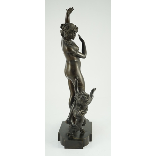 56 - A 19th century French bronze group of a muse dancing alongside a faun, 24cm wide, 52cm high