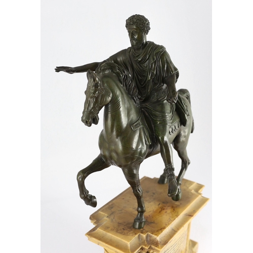 57 - After the Antique. A 19th century Italian Grand Tour bronze equestrian group, modelled as Emperor Ma... 