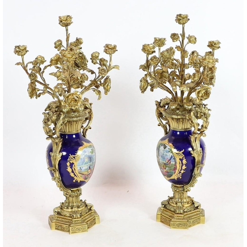 63 - A pair of large French Sevres style ormolu mounted candelabra, in Louis XVI style, 19th century, eac... 