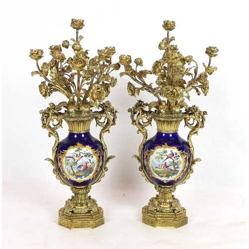 63 - A pair of large French Sevres style ormolu mounted candelabra, in Louis XVI style, 19th century, eac... 