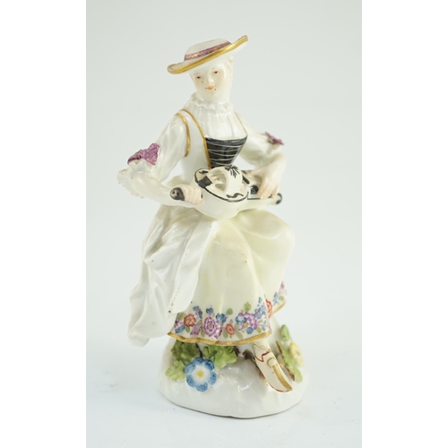 79 - A Meissen porcelain figure of a woman playing the hurdy gurdy, mid 18th century, possibly modelled b... 