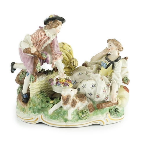 80 - A Frankenthal porcelain bucolic group of two lovers, c.1777, modelled with a woman reclining against... 