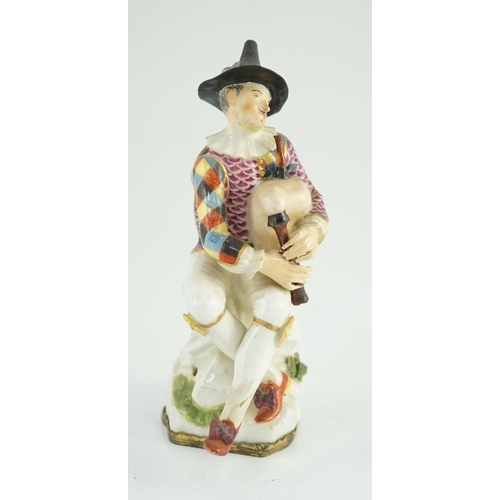 87 - A Meissen porcelain figure of a seated bagpiper, mid 18th century, modelled by J.J. Kandler, wearing... 