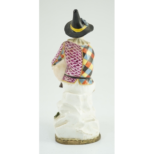 87 - A Meissen porcelain figure of a seated bagpiper, mid 18th century, modelled by J.J. Kandler, wearing... 