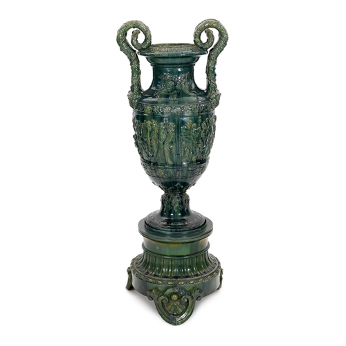 89 - A massive Continental majolica green glazed campana vase and associated stand, late 19th century, th... 