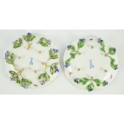 90 - Two Meissen flower encrusted cups and saucers, 19th century, typically painted with flower spray, in... 