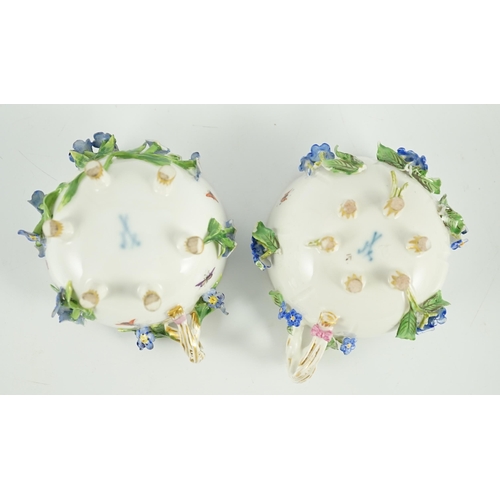 90 - Two Meissen flower encrusted cups and saucers, 19th century, typically painted with flower spray, in... 