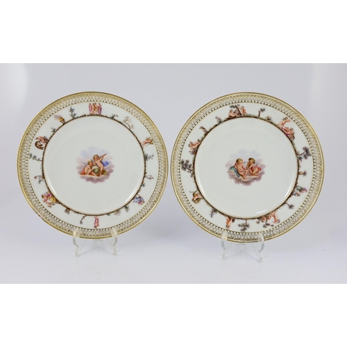 92 - A set of five Meissen Capo di Monte style plates, 19th century, each painted to the centre with cher... 