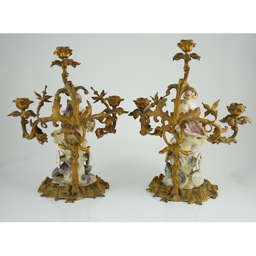 97 - A pair of large Derby porcelain and ormolu mounted Juno and Jupiter figural candelabra, the figure... 