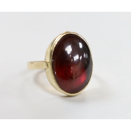 1947 - A 9ct and foil backed? oval cabochon garnet set ring, size O, gross weight 5.2 grams.