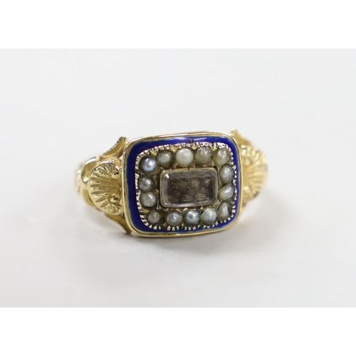 1952 - A 19th century yellow metal, enamel, seed pearl and plaited hair set mourning ring, with shell decor... 