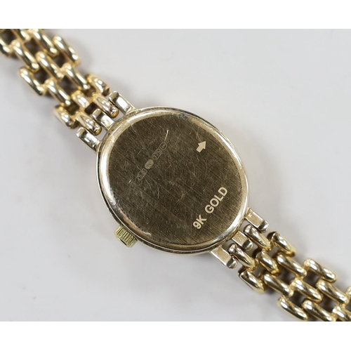 1954 - A lady's modern 9k Rotary Elite oval dial quartz wrist watch, on a 375 bracelet, overall 18cm, gross... 