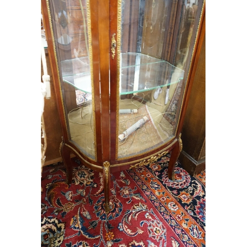 1028 - A Louis XV style gilt metal mounted marble topped bow fronted vitrine, width 67cm, depth 34cm, heigh... 