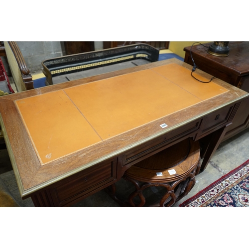 1035 - An Empire style brass mounted mahogany kneehole desk, width 130cm, depth 66cm, height 76cm