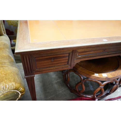 1035 - An Empire style brass mounted mahogany kneehole desk, width 130cm, depth 66cm, height 76cm