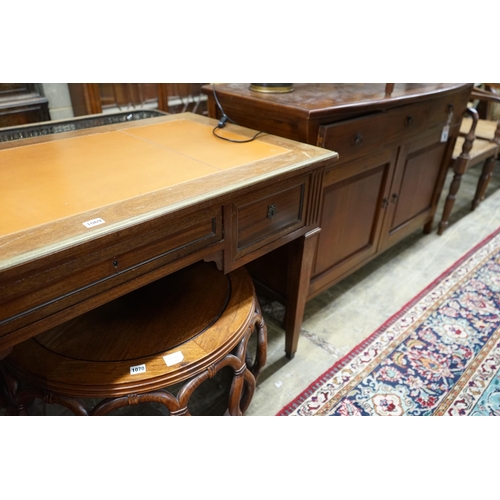 1035 - An Empire style brass mounted mahogany kneehole desk, width 130cm, depth 66cm, height 76cm