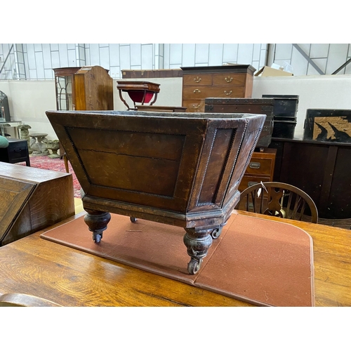 1055 - A George IV octagonal mahogany cellarette lacking cover, width 69cm, depth 54cm, height 50cm