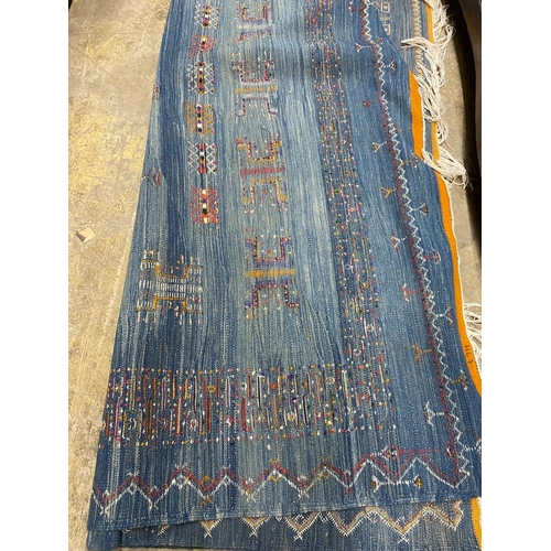 1067 - A Kilim polychrome carpet, approx. 320 x 200cm