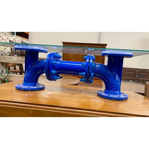 1080 - An industrial style cast iron steam pump glass top coffee table, length 93cm, width 48cm, height 29c... 