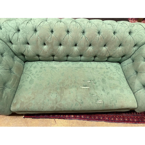 1091 - A Victorian double drop arm Chesterfield settee upholstered in a deep buttoned green fabric, length ... 