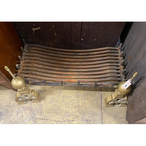 1098 - A cast iron rectangular fire grate, width 90cm, depth 42cm together with a pair of Dutch style brass... 