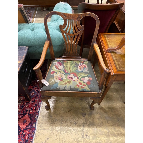 1110 - A George III provincial elm seat elbow chair with tapestry upholstered drop in seat, width 66cm, dep... 