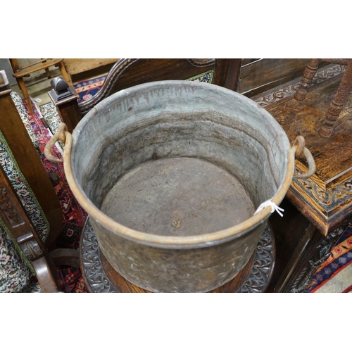 1138 - A Victorian brass and wrought iron cauldron with wrought iron swing handle, diameter 56cm, height 35... 