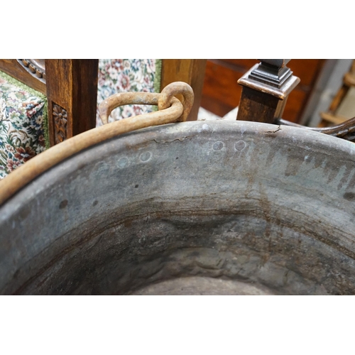 1138 - A Victorian brass and wrought iron cauldron with wrought iron swing handle, diameter 56cm, height 35... 