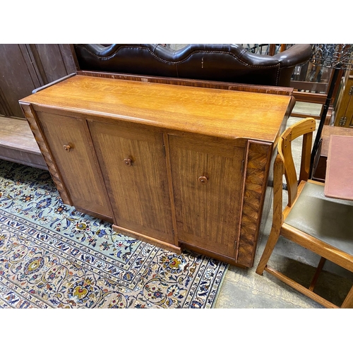 1157 - An early 20th century oak and zebra wood dining suite by Ebenezer Gomme, comprising draw leaf table,... 