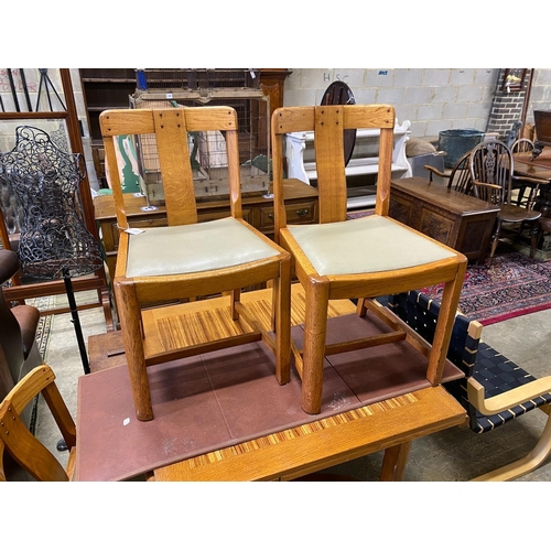 1157 - An early 20th century oak and zebra wood dining suite by Ebenezer Gomme, comprising draw leaf table,... 