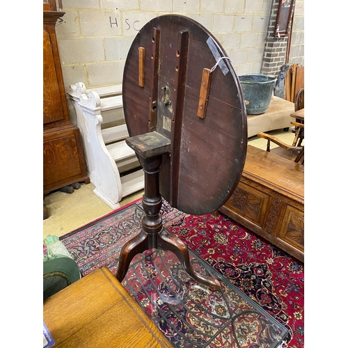 1169 - A George III and later mahogany circular tilt top tripod tea table, diameter 73cm, height 70cm... 