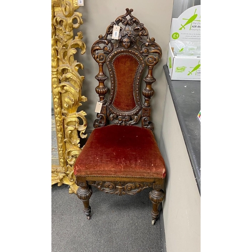 1221 - A pair of 19th century Flemish carved oak side chairs, height 118cm