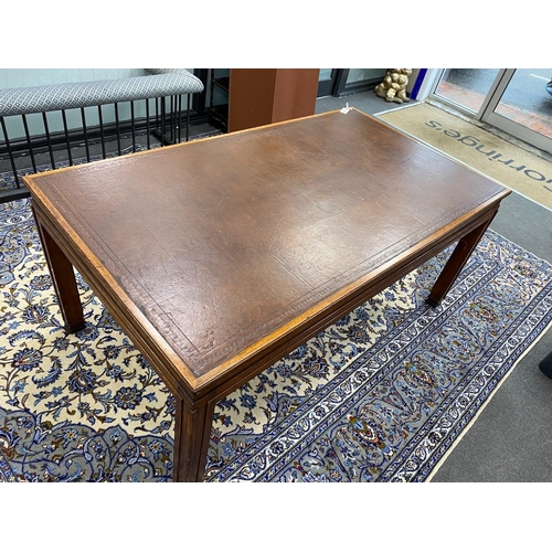 1223 - An Art Deco rectangular mahogany library table with leather inset top, bears Howard & Son retail pla... 