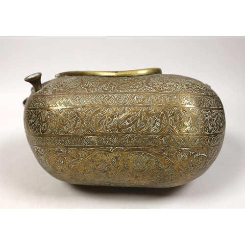 1262 - A 19th century Persian engraved brass kashkul, Qajar dynasty, 16cm wide and a bronze kettle, 17cm ta... 