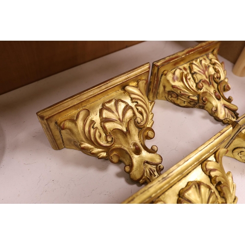 1271 - A set of four gilt wood wall brackets, 18.5cm tall x 24cm wide