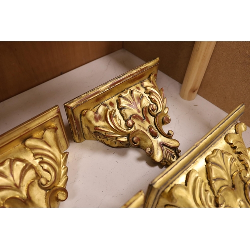 1271 - A set of four gilt wood wall brackets, 18.5cm tall x 24cm wide