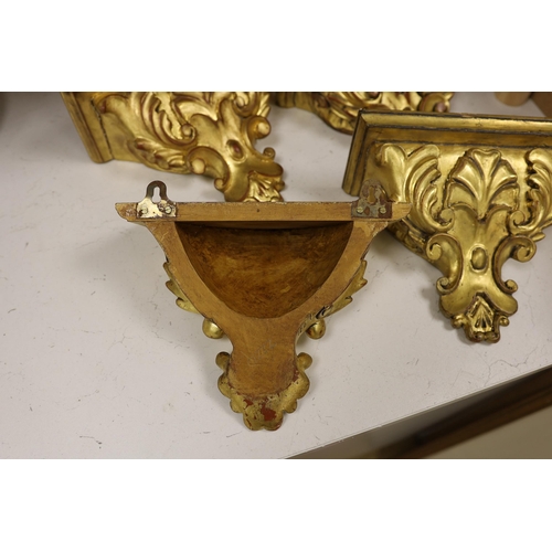 1271 - A set of four gilt wood wall brackets, 18.5cm tall x 24cm wide