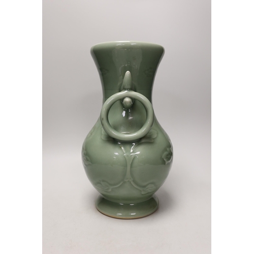 1301 - A two handled Chinese celadon glazed vase. 32cm tall