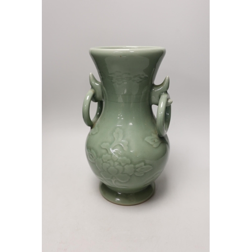 1301 - A two handled Chinese celadon glazed vase. 32cm tall