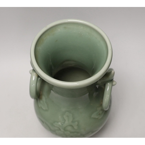 1301 - A two handled Chinese celadon glazed vase. 32cm tall